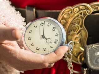 Santa holding a pocket watch