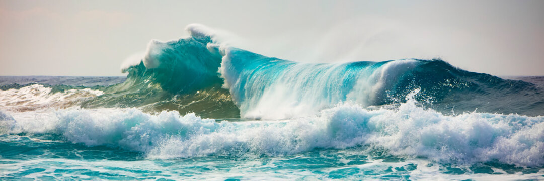 Tropical ocean wave crashing and splashing, Na Pali Coast; Kauai, Hawaii, United States of America - Powered by Adobe