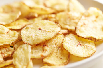 dry potato chips on a plate	