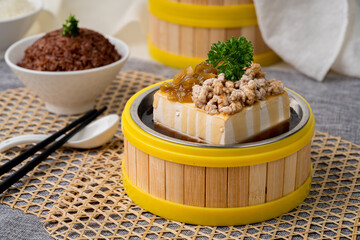 STEAMED TOFU With MINCED PORK and PICKLED LETTUCE with chopsticks served in dish isolated on table top view of singapore food
