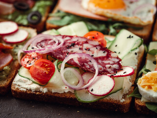 sandwiches with salami, vegetables and black sesame