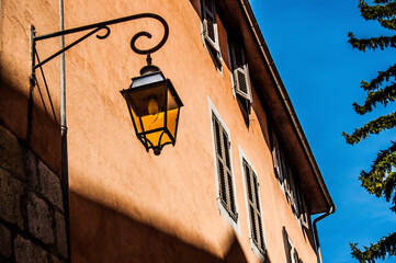 An old street lamp in the street.