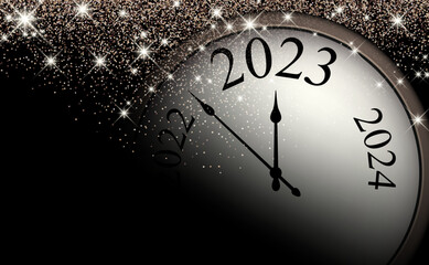 Half-hidden clock showing 2023 with sparkling stars.