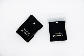 Lithium rechargeable battery from the camera. Battery for the device on a white background. Analog...