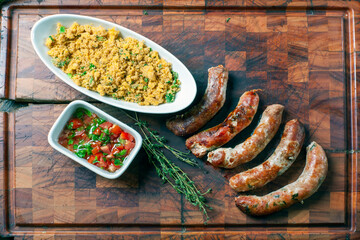 Pork sausage with farofa and vinaigrette