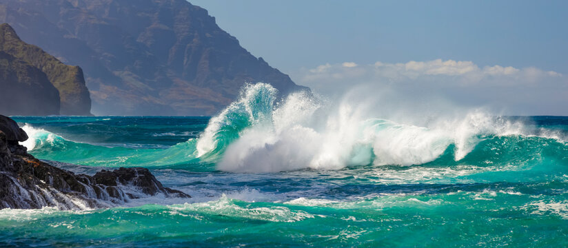 Large waves crashing along the Na Pali coast at Ke'e Beach; Kauai, Hawaii, United States of America