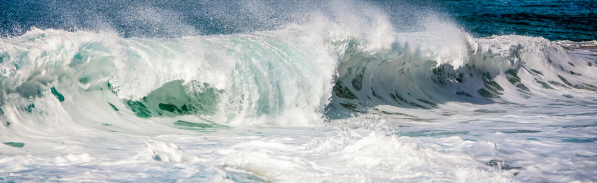 Waves crashing into the shore; Hawaii, United States of America