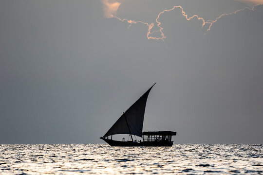 Dhow on the Indian Ocean at sunset; Zanzibar City, Unguja Island, Zanzibar, Tanzania