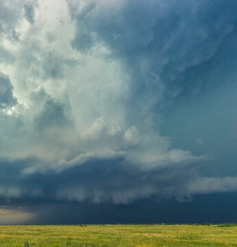An enormous thunderstorm updraft erupts above the high plains of the Texas Panhandle; Texas, United States of America