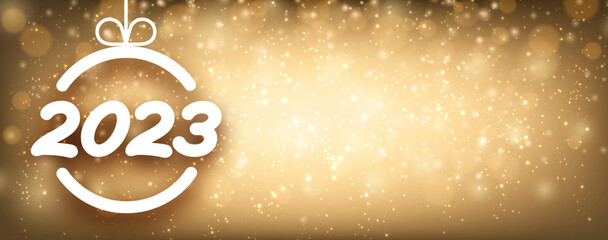 2023 sign in christmas bauble on golden snowing background.