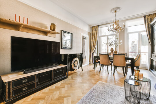 Interior of spacious cozy living room with wooden antique furniture
