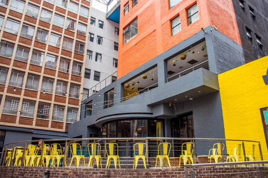 Johannesburg / South Africa - November 19 2016: colorful painted buildings and a cafe front in Braamfontein in the city center
