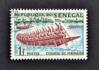  Cancelled postage stamp printed by Senegal, that shows Pirogues racing, circa 1961.
