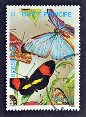 Cancelled postage stamp printed by Sao Tome and Principe, that shows Blades of grass, Butterflies,...