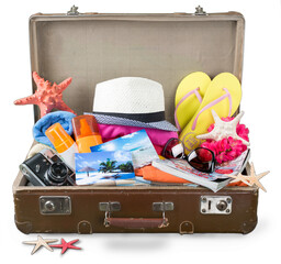Retro old suitcase with travel objects
