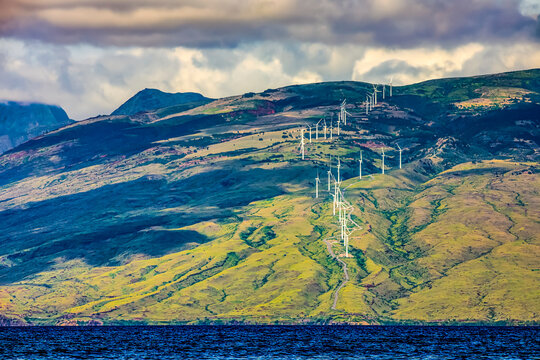 Kaheawa Wind Power wind farm situated in the West Maui Mountains catches trade winds blowing through Maui's Isthmus valley; Maui, Hawaii, United States of America