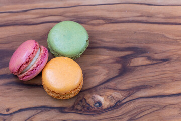 French macaroons on a wooden background 