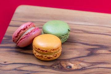 French macaroons on a wooden background 