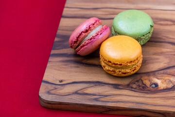 French macaroons on a wooden background 