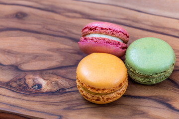 French macaroons on a wooden background 