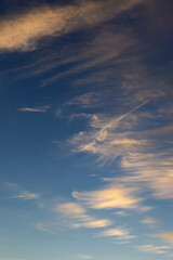 blue sky with golden clouds beautifully illuminated by the sun as a natural background