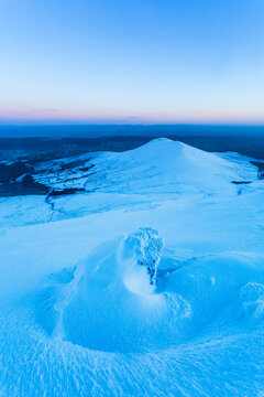 Snow formations on the Galty mountains looking north towards the Limerick countryside; County Tipperary, Ireland