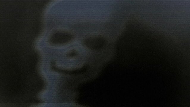 Creepy face appears on dark smoke distorted background