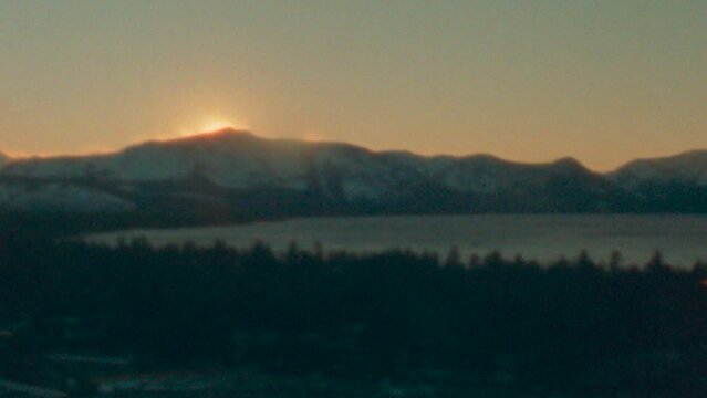Vintage 8mm sunset behind a mountain in Lake Tahoe