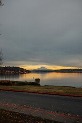 cloudy glowing sunset at Seward Park in Seattle with view of Mt. Rainier