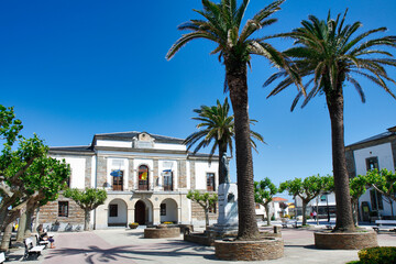 Fototapeta na wymiar Monument dedicated to Fernando Casariego and Town Hall in background, Tapia de Casariego, Asturias, Spain