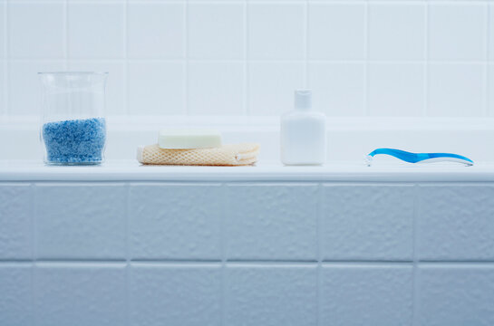 Bath Products on Edge of Bathtub