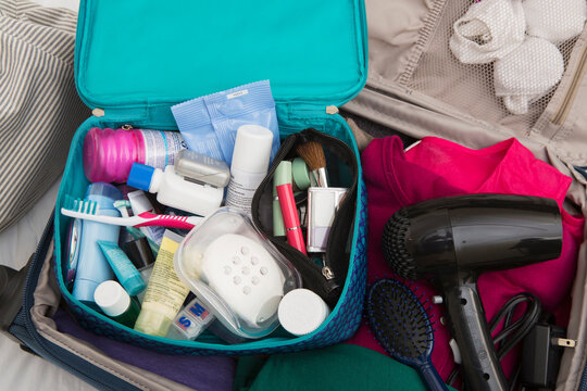 Women's Toiletry Travel Bag in Packed Suitcase