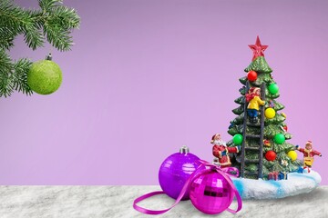 Christmas composition with green tree, decorations on desk