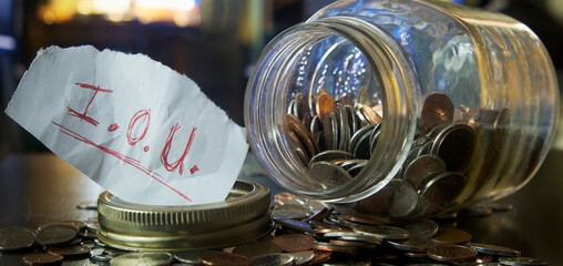 Mason Jar with Coins and IOU Note