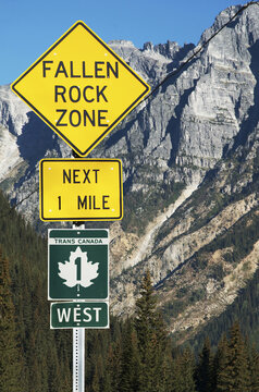 Close-up of sign on Trans Canada Highway with Rocky Mountains in background, near Revelstoke, BC, Canada