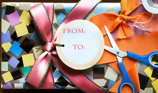 Wrapped present with scissors, tape and ribbon