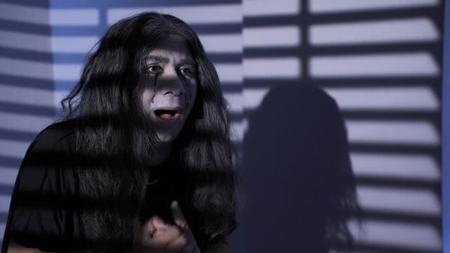 An emo teenager in the emotional void.
Emo teenager with trembling hands. He is anxious and has psychological problems.
