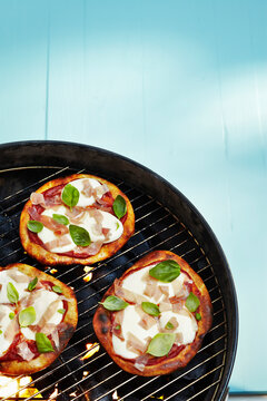 High Angle View of Pita Pizzas on Barbecue Grill in Studio