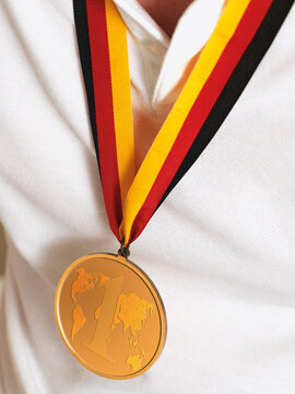 Man in Sport Shirt Wearing Gold Medal