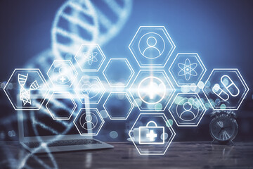 Desktop computer background and DNA drawing. Double exposure. Science concept.