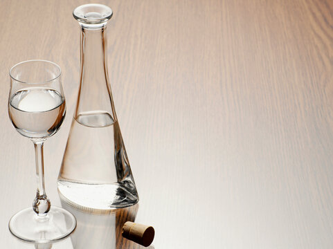 Glass of Grappa with Carafe and Cork, Studio Shot