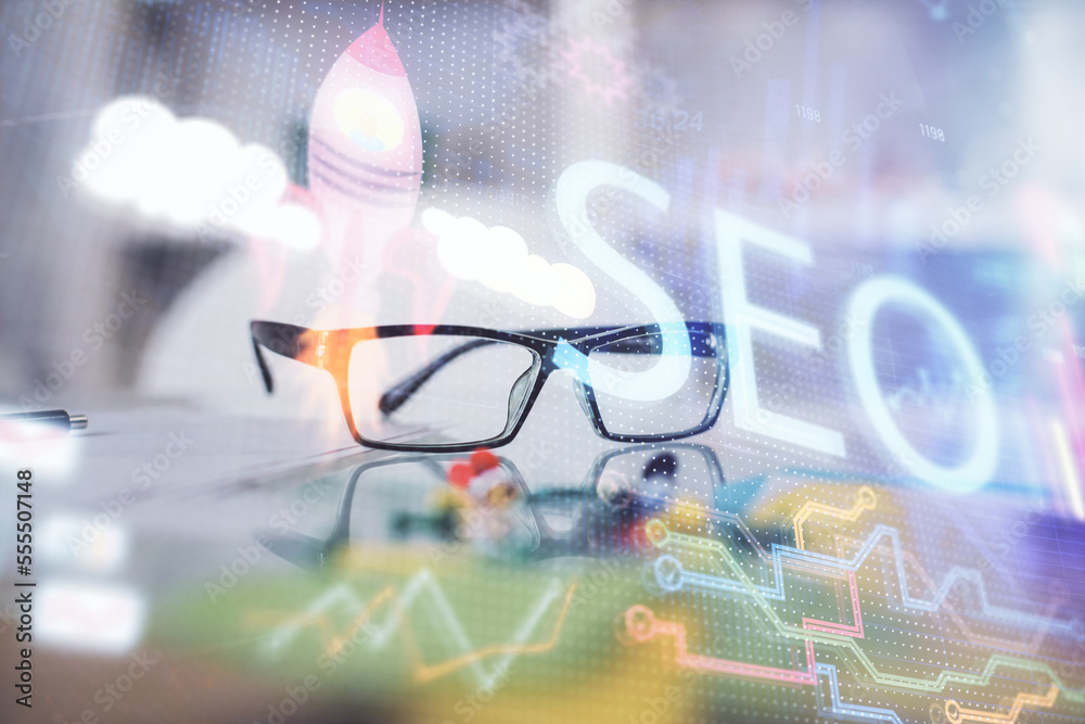 Aufkleber SEO hologram with glasses on the table background. Concept of search engine optimization. Double exposure.