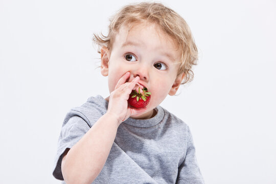 Boy Eating Strawberry