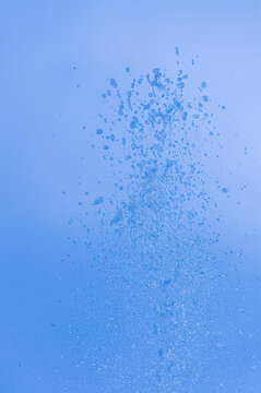 Drops of water fountain against blue sky, Salzburg, Austria