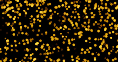 Golden blurred bokeh lights on black background