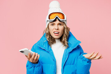 Snowboarder sad woman wear blue suit goggles mask hat ski padded jacket hold use mobile cell phone...