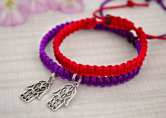 Couple of hand made colorful bracelets of boho style