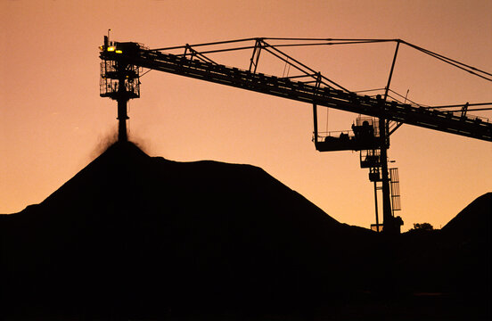 Black Coal Mining, Stockpiling Coal, Sunset Silhouette