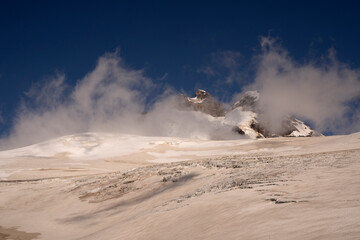 Alpine landscape. High in the Andes mountains. View of Tronador hill peak and glacier Castaño Overo ice field under a beautiful blue sky, in Pampa Linda, Patagonia Argentina.