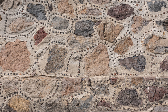 Close up of a rock wall in the ruins of Teotihuacan, Mexico.
Stone with little volcanic rocks to reveal the work of reconstruction accomplished.
